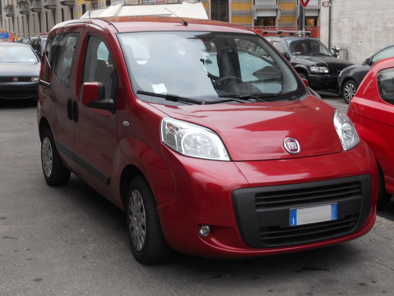 Compact MPV with tall headlights and large black grille