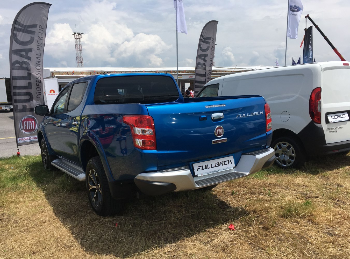 Rear view of blue double cab pickup with distinct taillights and tailgate
