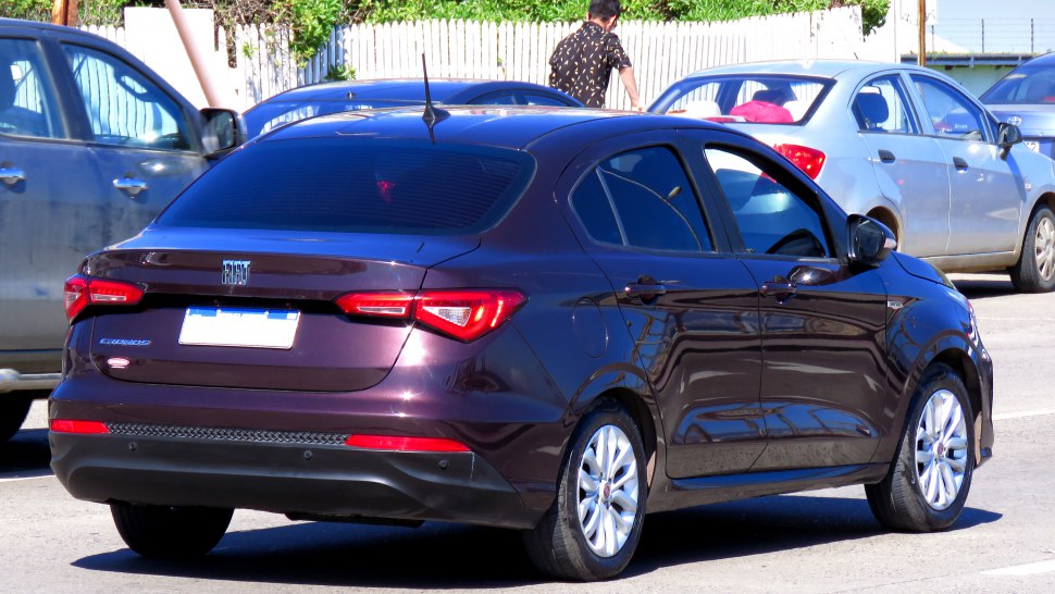 Rear view of a sleek sedan with distinctive modern tail lights and curved rear design.