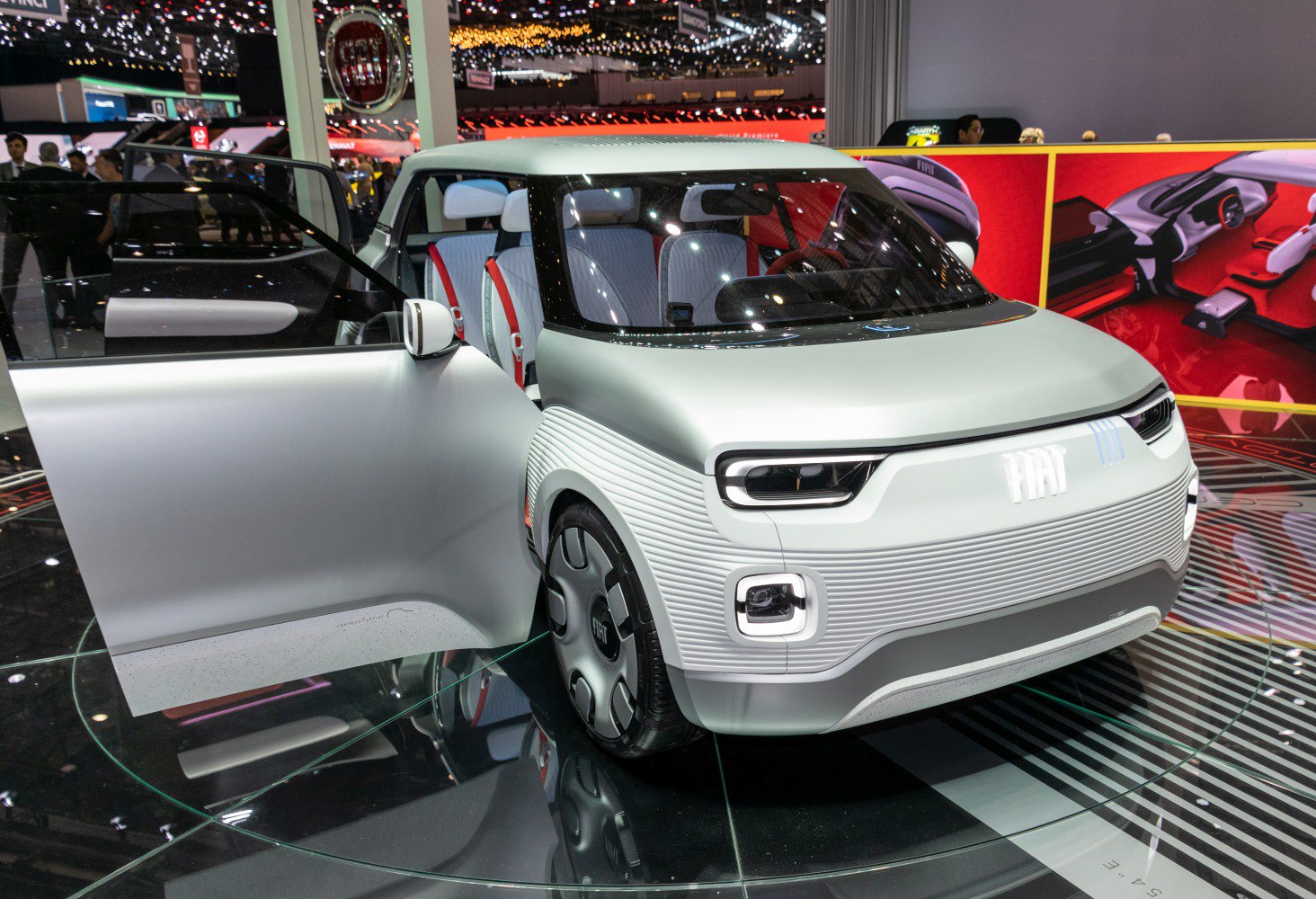 Futuristic modular exterior and distinctive front lighting with open door view