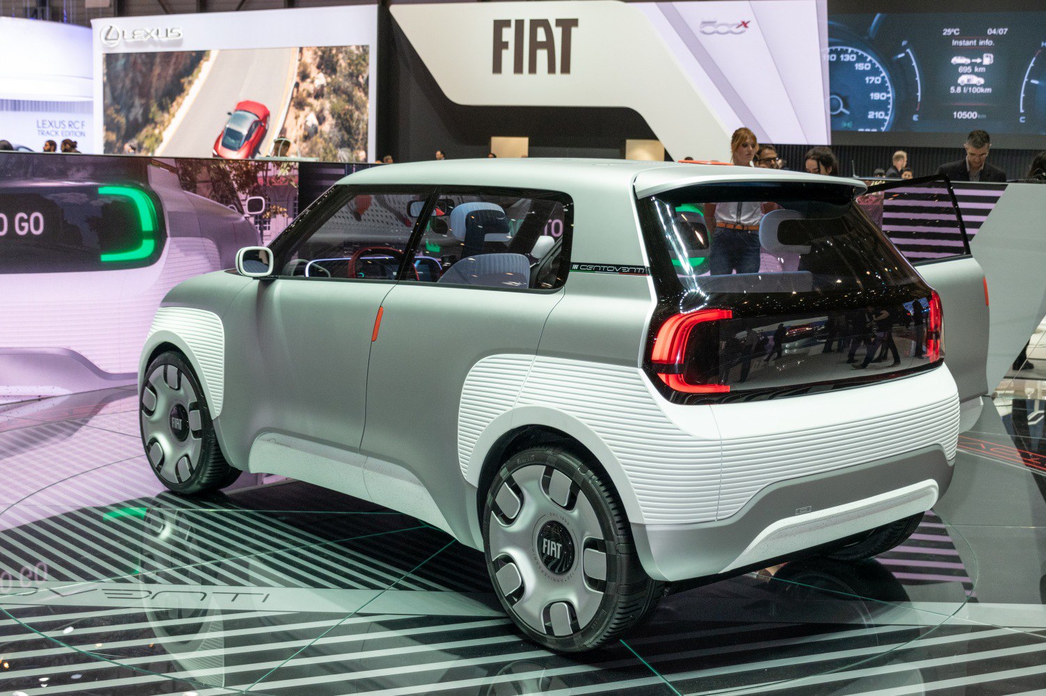 Rear and side view of a futuristic compact concept EV with distinct taillights and smooth lines.