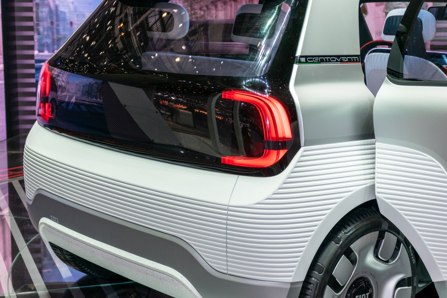 Rear LED tail light and wheel design with textured rear bumper.