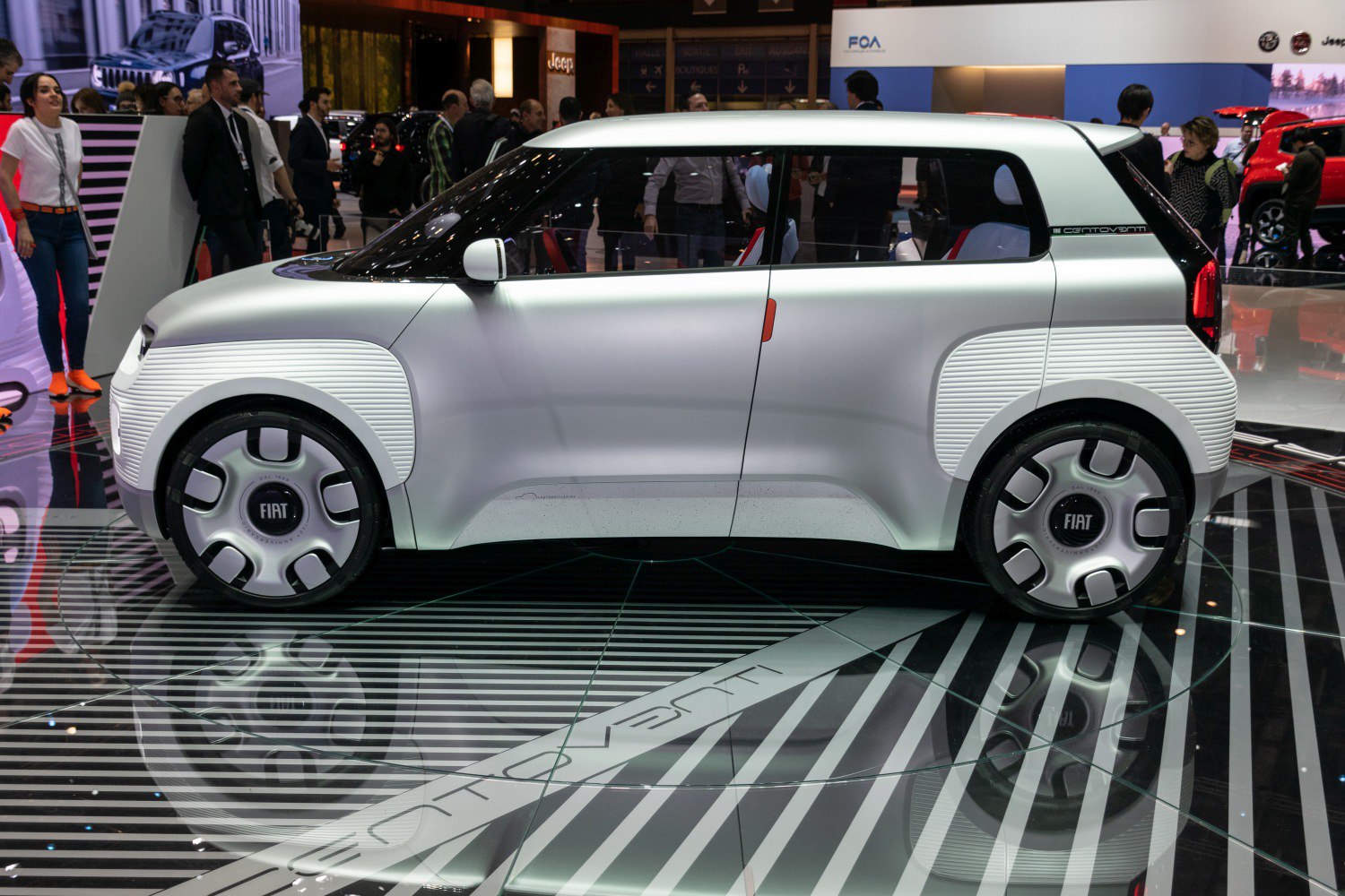 Futuristic compact electric urban vehicle side profile with unique panel design