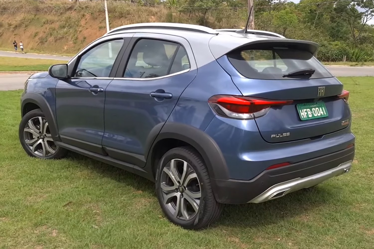 Rear side of compact SUV with tail lights and alloy wheels