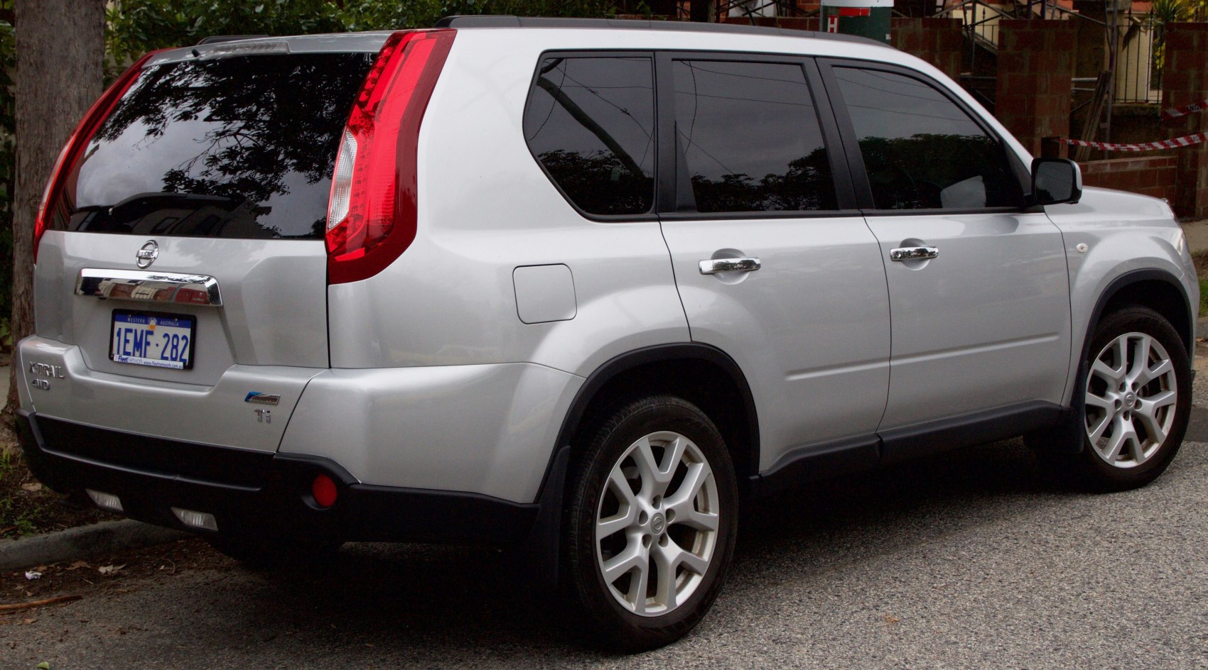 Silver SUV rear and side view with distinctive taillights and alloy wheels