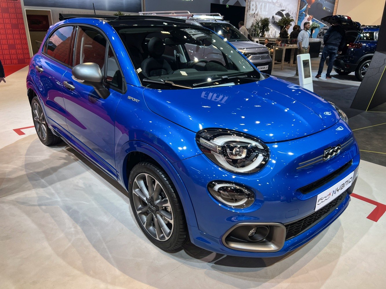 Blue compact hatchback with sporty design and modern headlights
