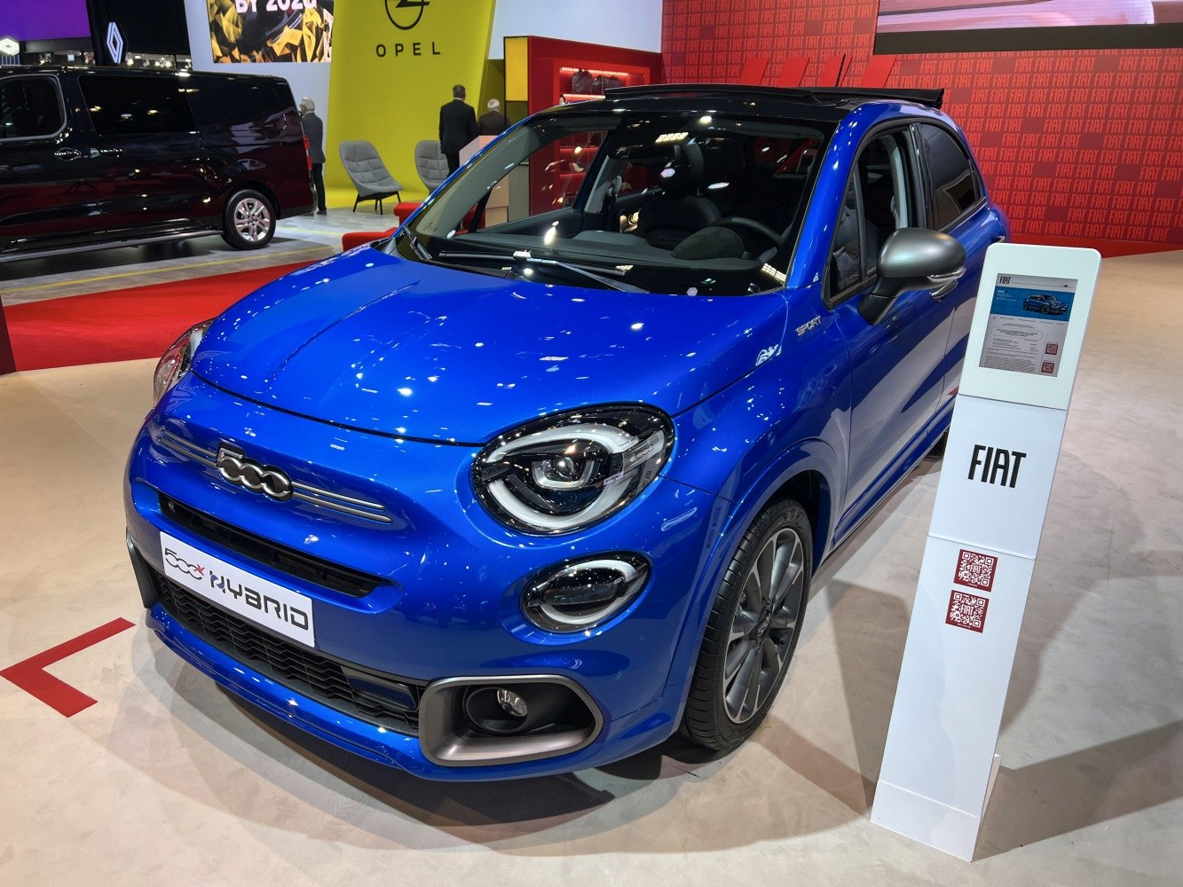 Front angle view of Fiat 500X hybrid with prominent headlights and sleek design