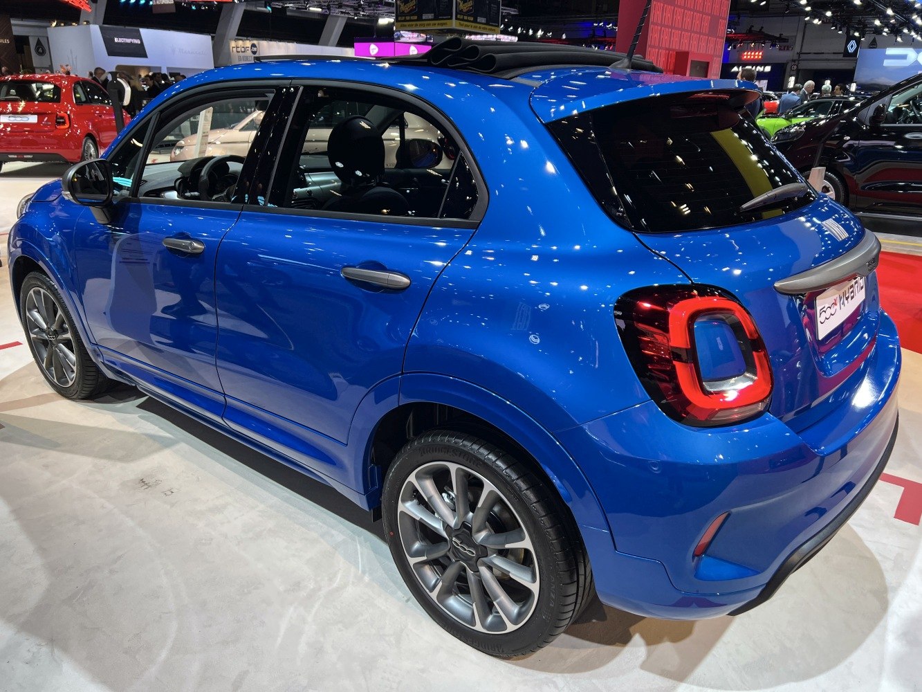 Rear side view of hatchback with distinctive block-shaped tail lights and alloy wheels.