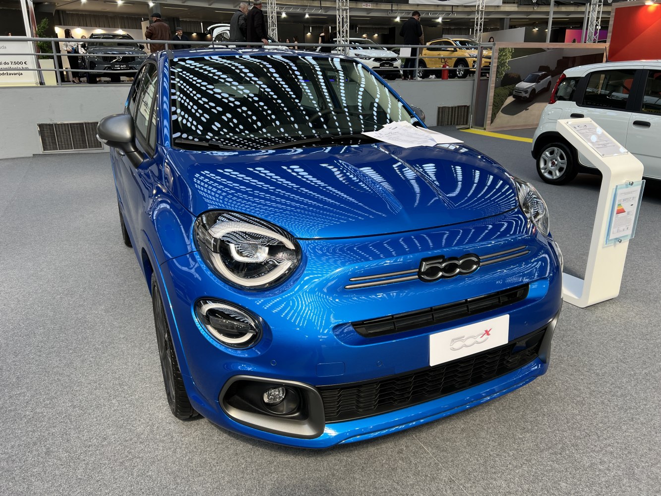 Blue SUV front with LED headlights and 500 emblem on grille