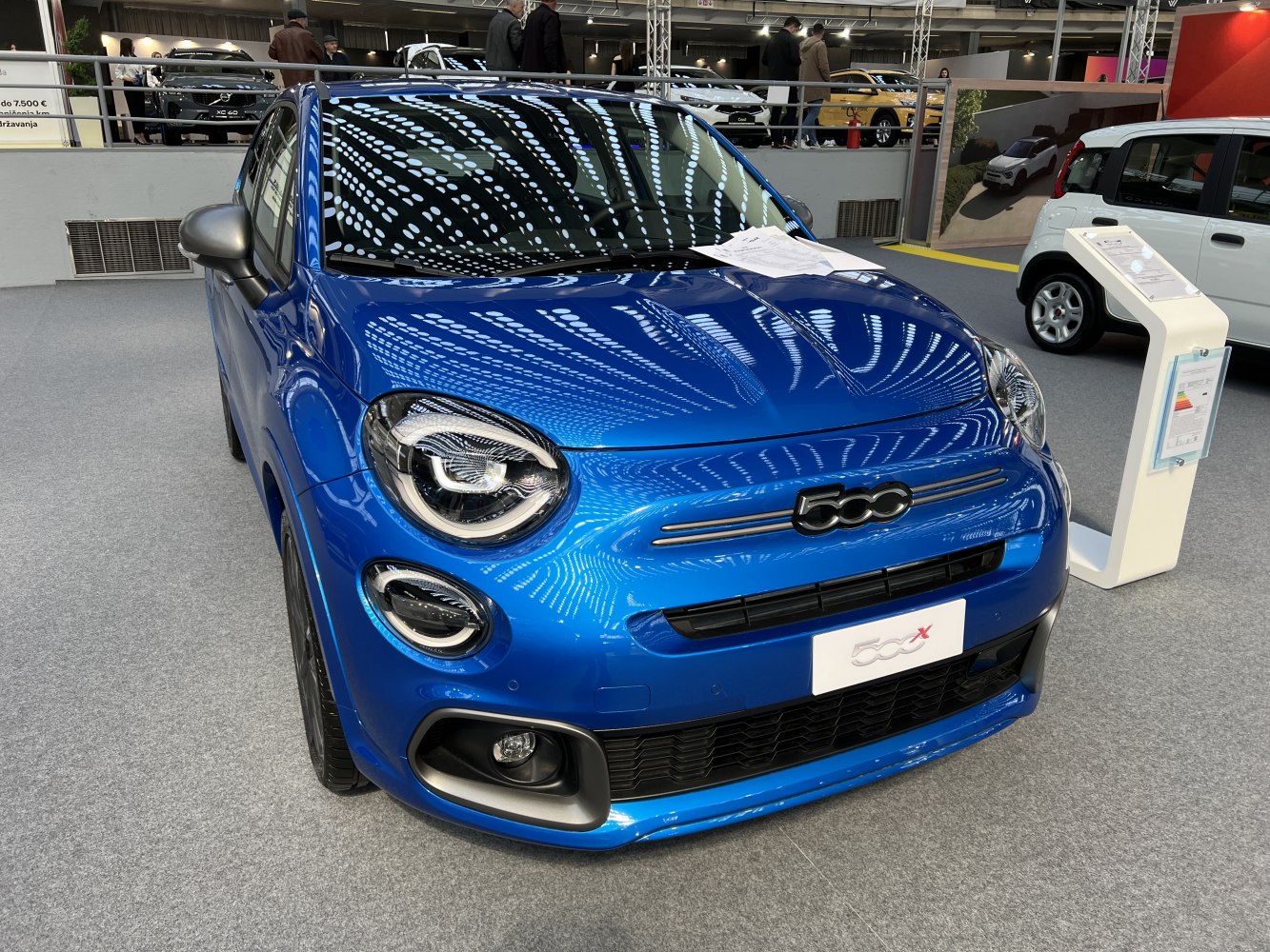 Close-up of front fascia with LED headlights and grille