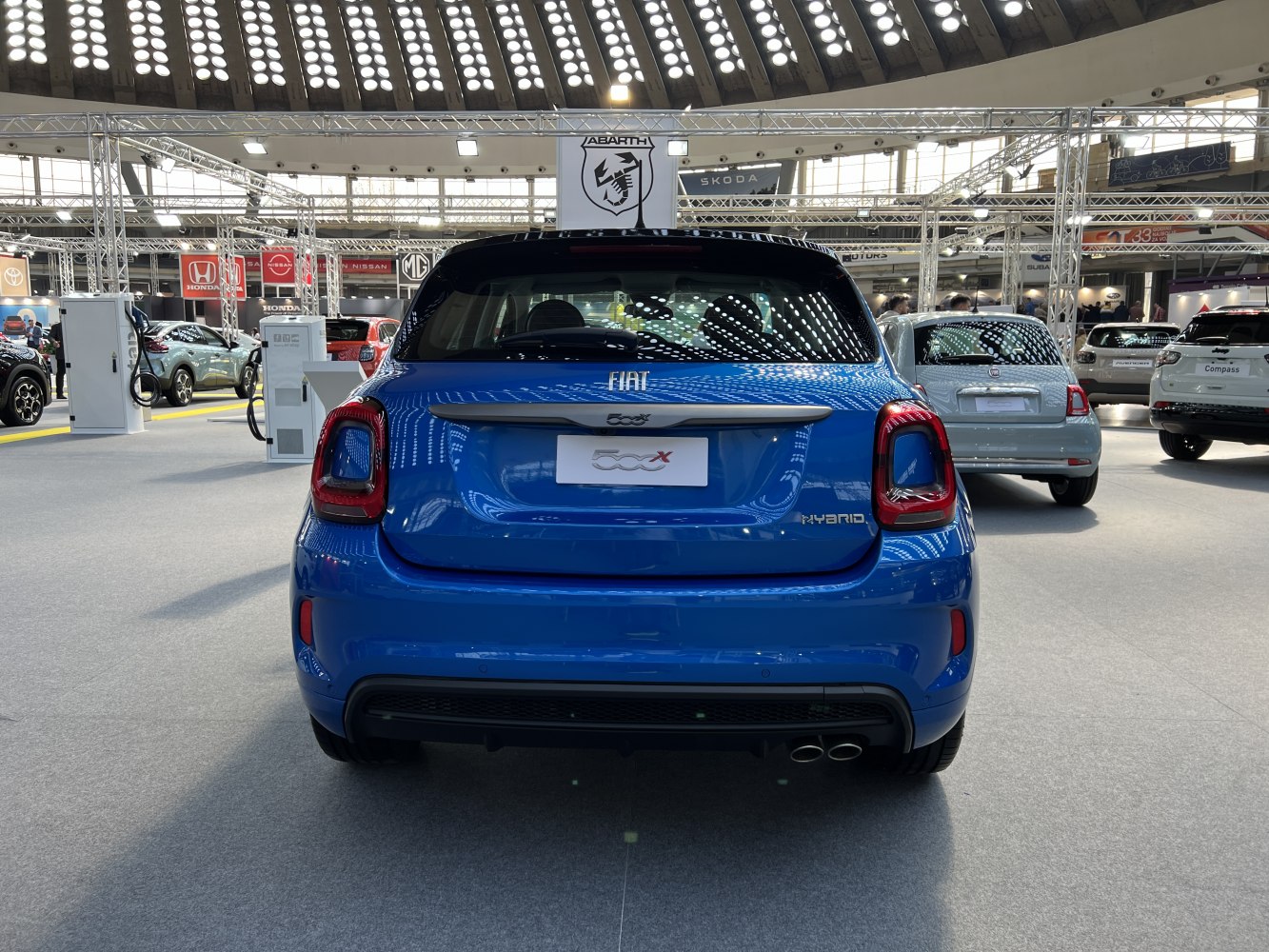 Rear view of compact SUV with distinct taillights and hybrid badge
