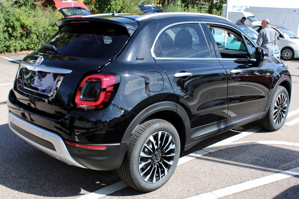 Rear and side view with distinctive taillights and alloy wheels