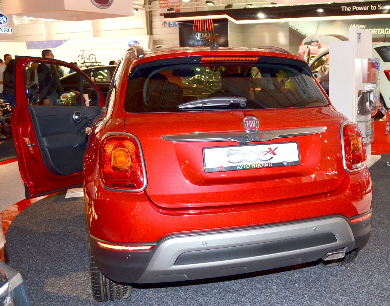 SUV rear view with open door and distinctive tail lights