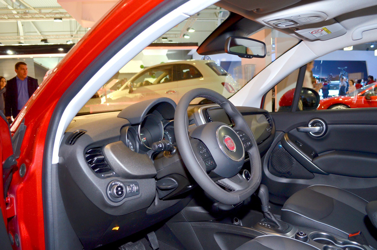 Interior dashboard and steering wheel with control features