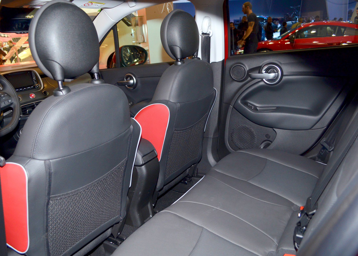 Rear interior seating with black leather and red accents
