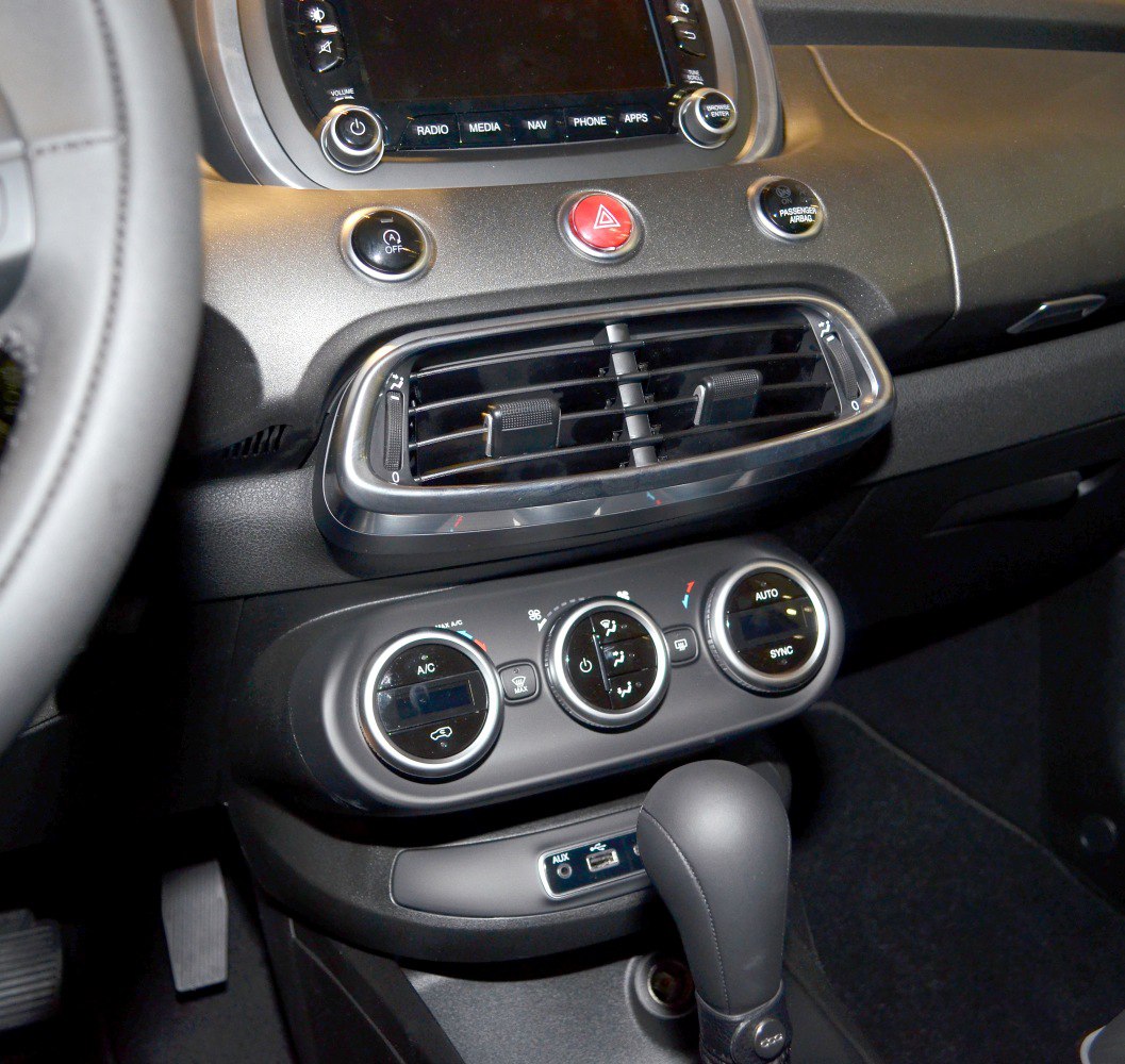 Interior dashboard with air vents and climate control knobs