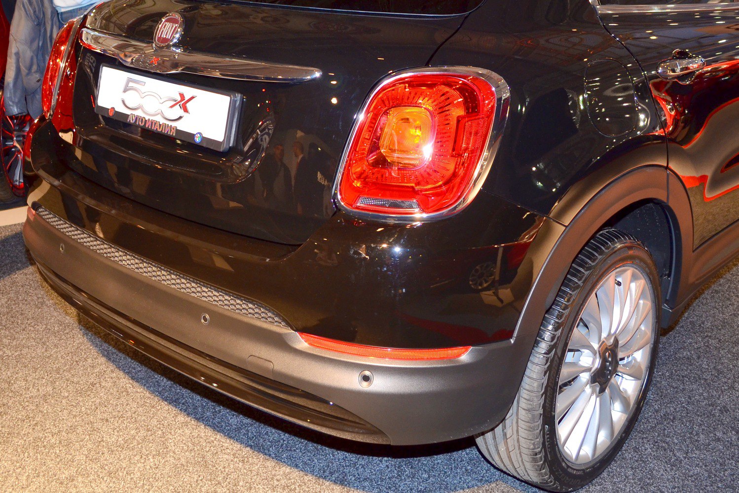 Rear light, bumper, and wheel design close-up