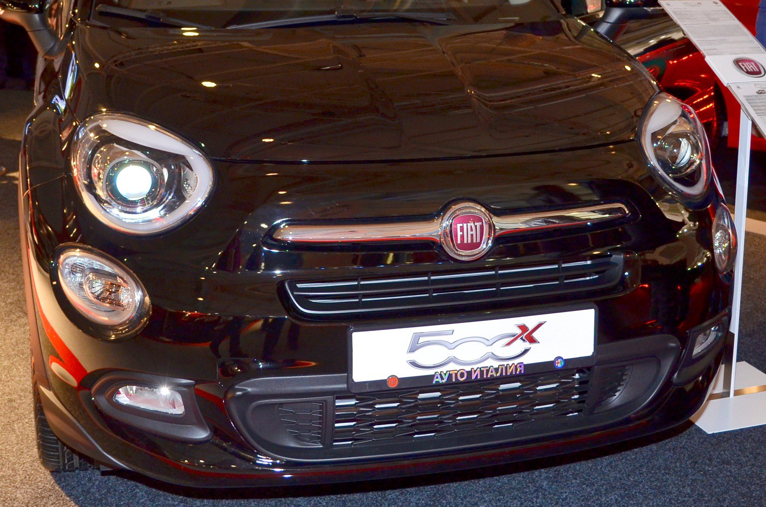 Round headlights and chrome grille close-up view