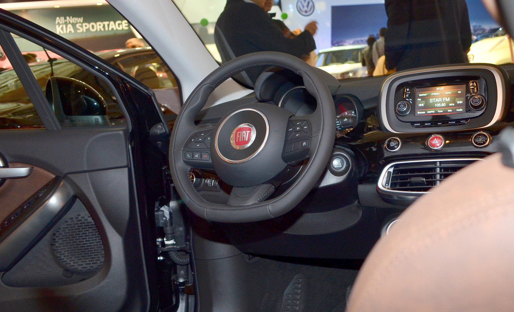 Steering wheel with control buttons and digital dashboard display