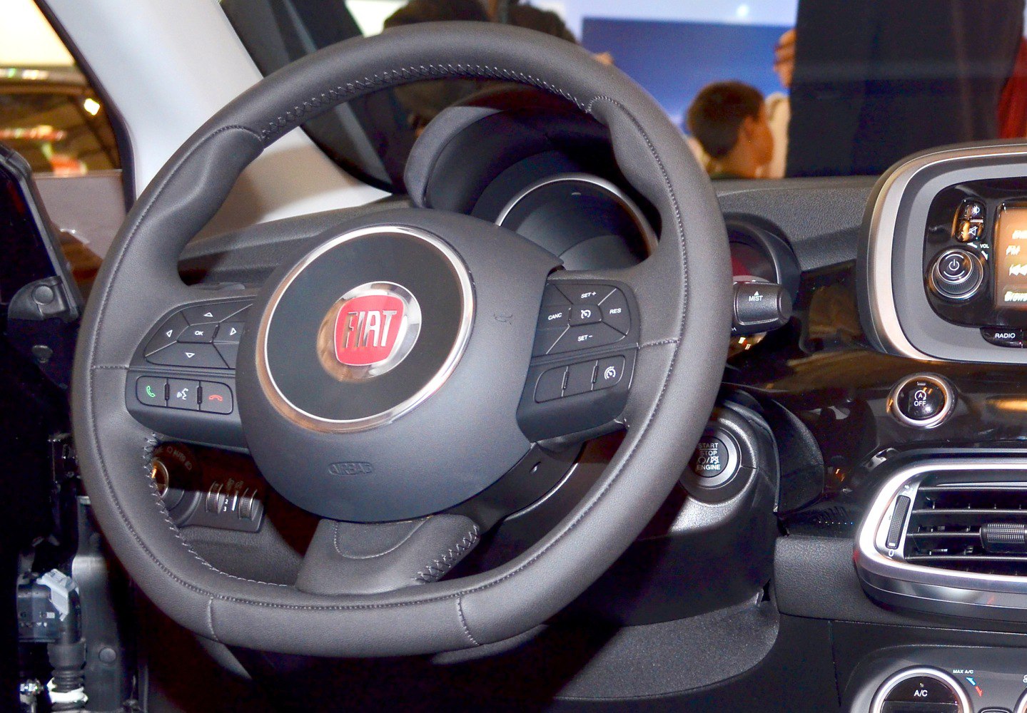 Steering wheel with integrated controls and dashboard instruments