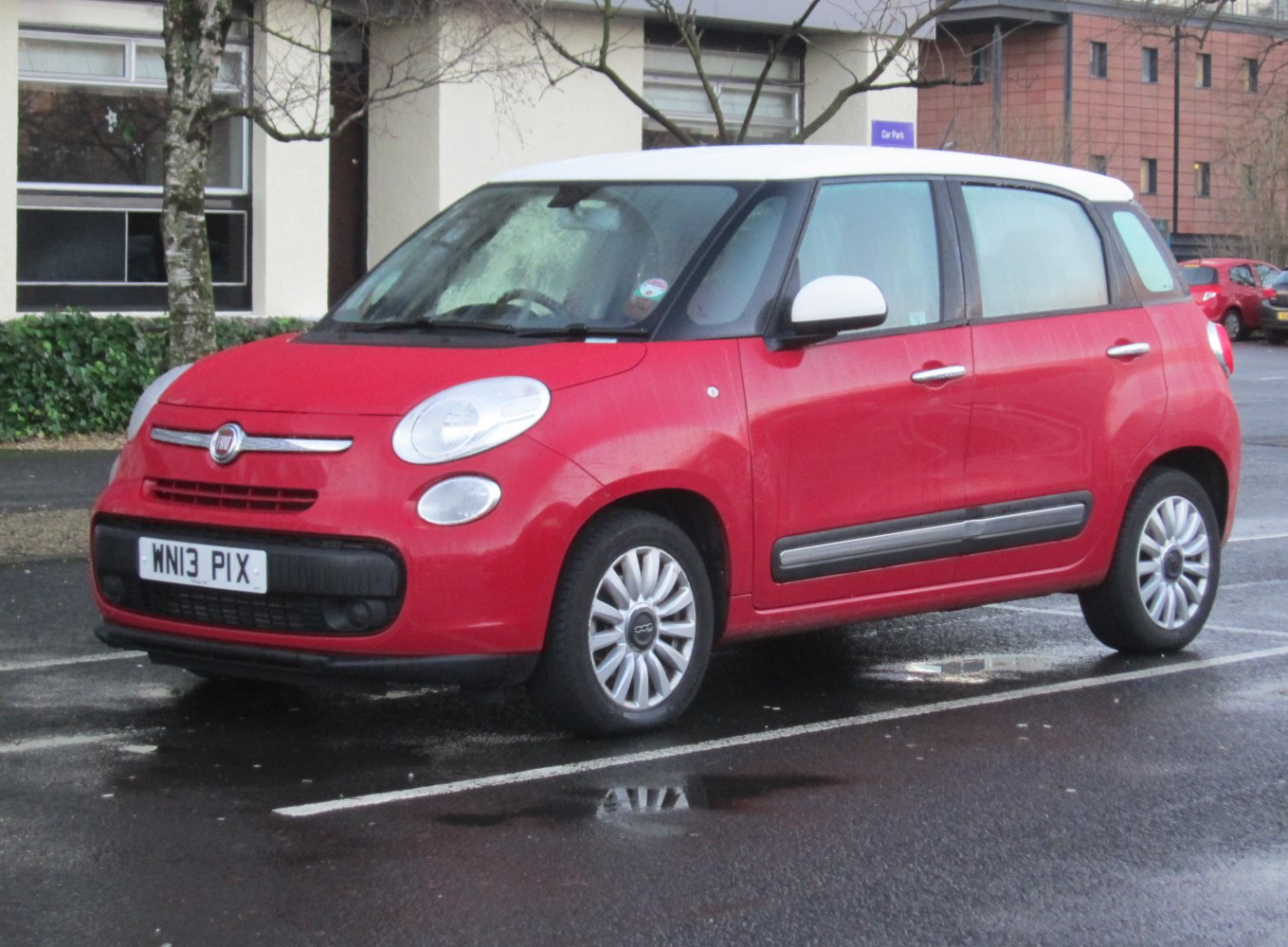 compact wagon with rounded headlights and two-tone roof
