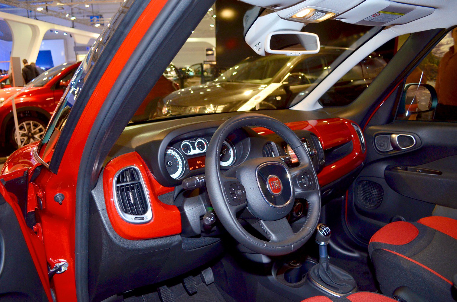 Red-accented dashboard, steering wheel, and manual gear shift