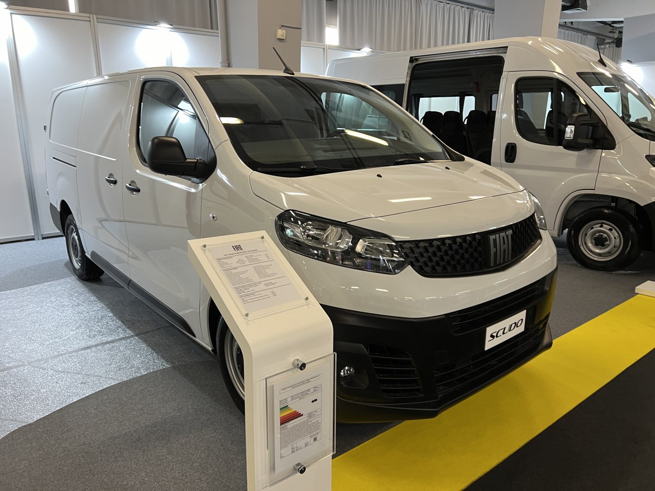 White commercial panel van front and side profile with black grille and modern headlights