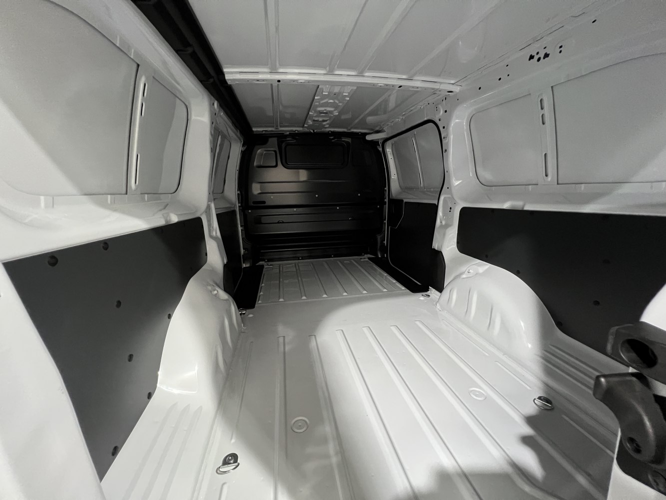 Spacious metal-floored cargo area with protective side panels