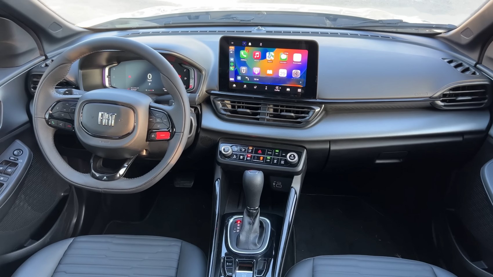 Digital dashboard, touchscreen infotainment, steering wheel with controls
