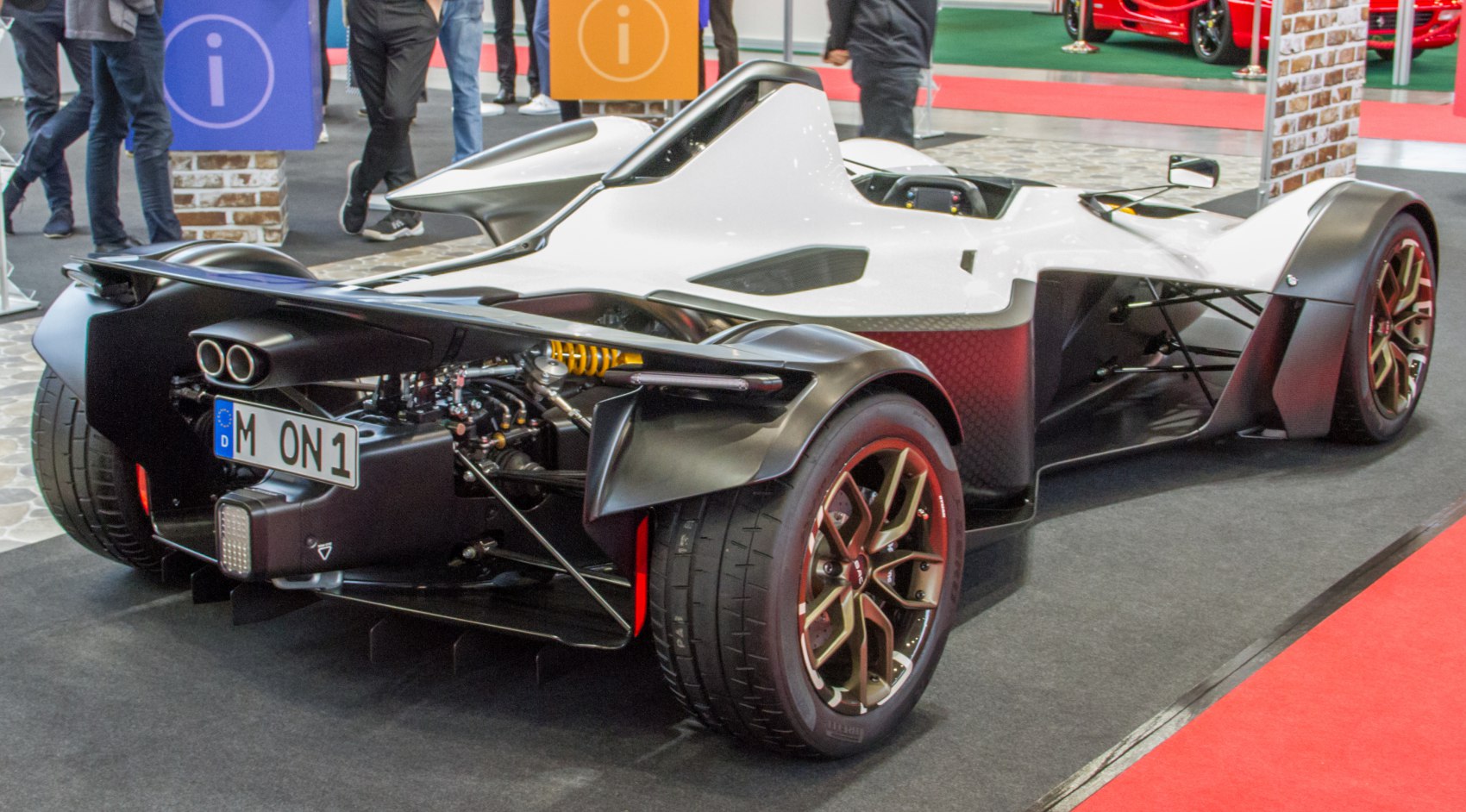 Exposed rear suspension, dual exhaust tips, and sporty wheels