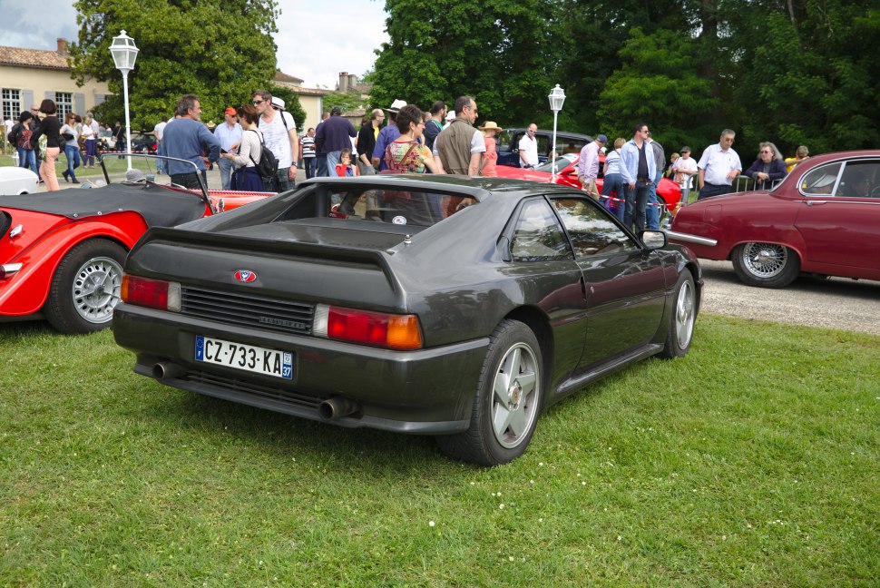 Distinctive rear view of a 1989 sport coupe with taillights and rear spoiler.