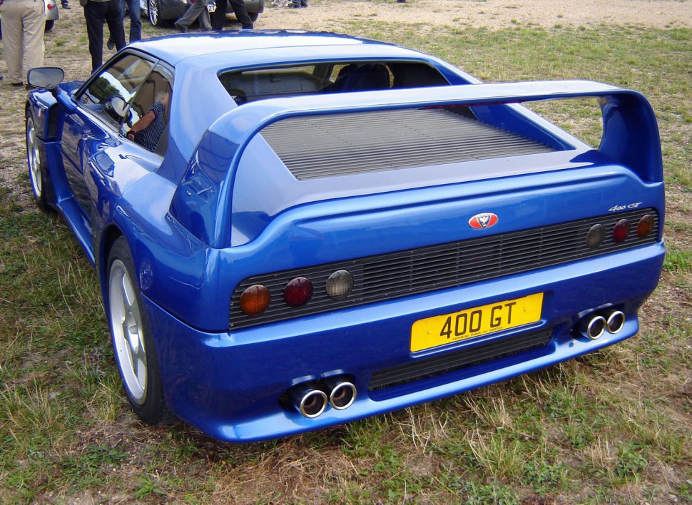 Rear view with large spoiler and quad exhaust pipes