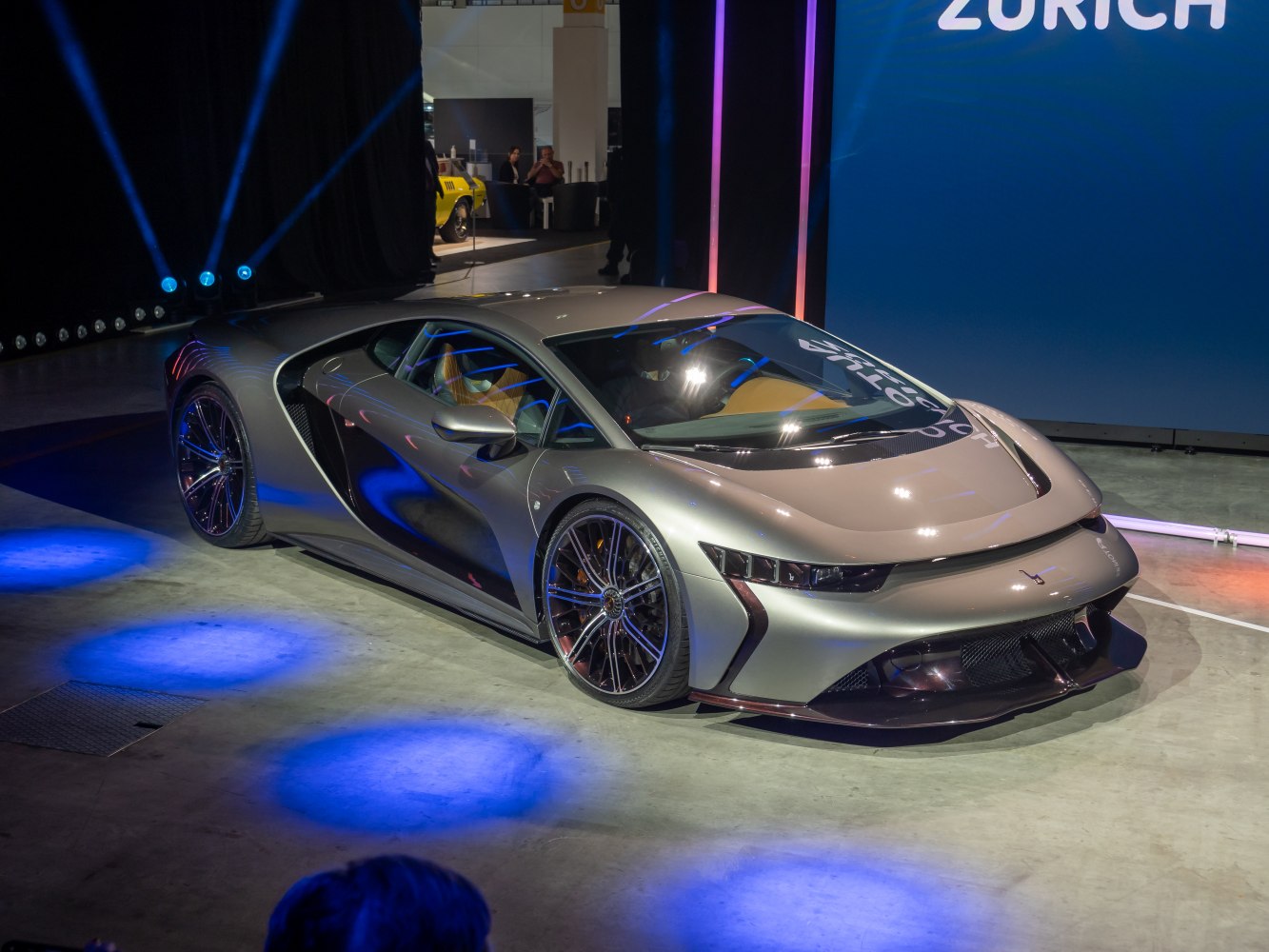 Sleek aerodynamic sports car with futuristic LED headlights and modern wheels