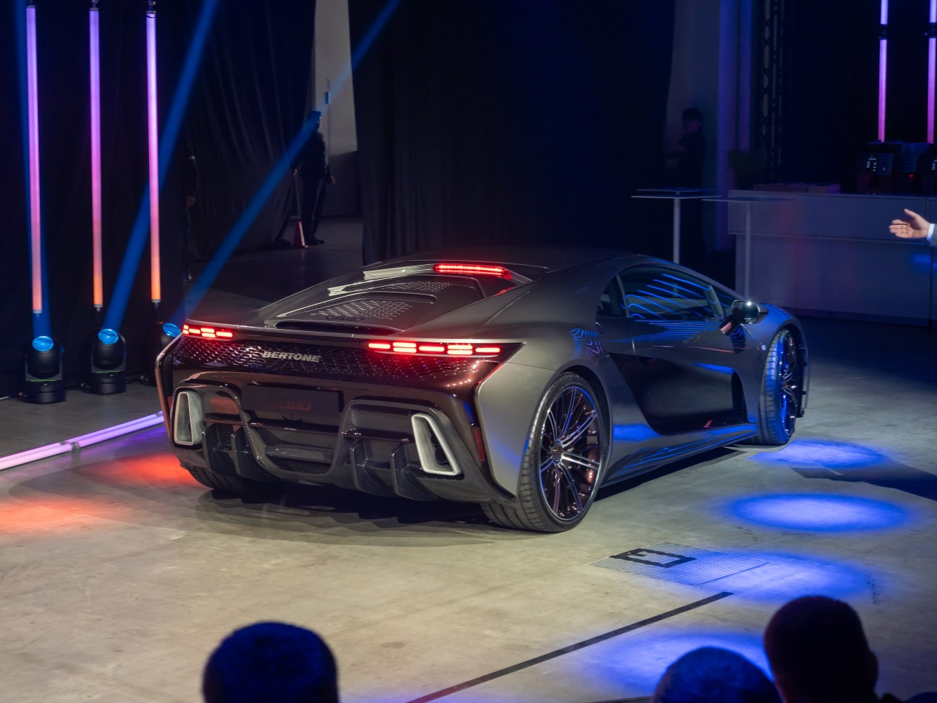 Rear view of sleek sports coupe with LED taillights and diffuser