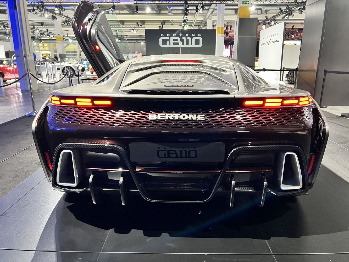 Futuristic LED tail lights and aerodynamic diffuser with integrated exhausts