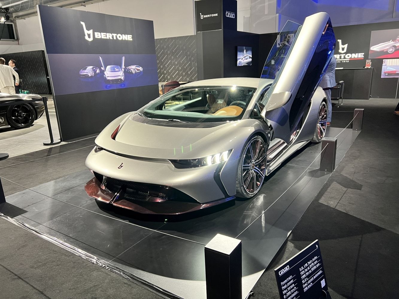Butterfly doors and sleek aerodynamic body with modern styling.