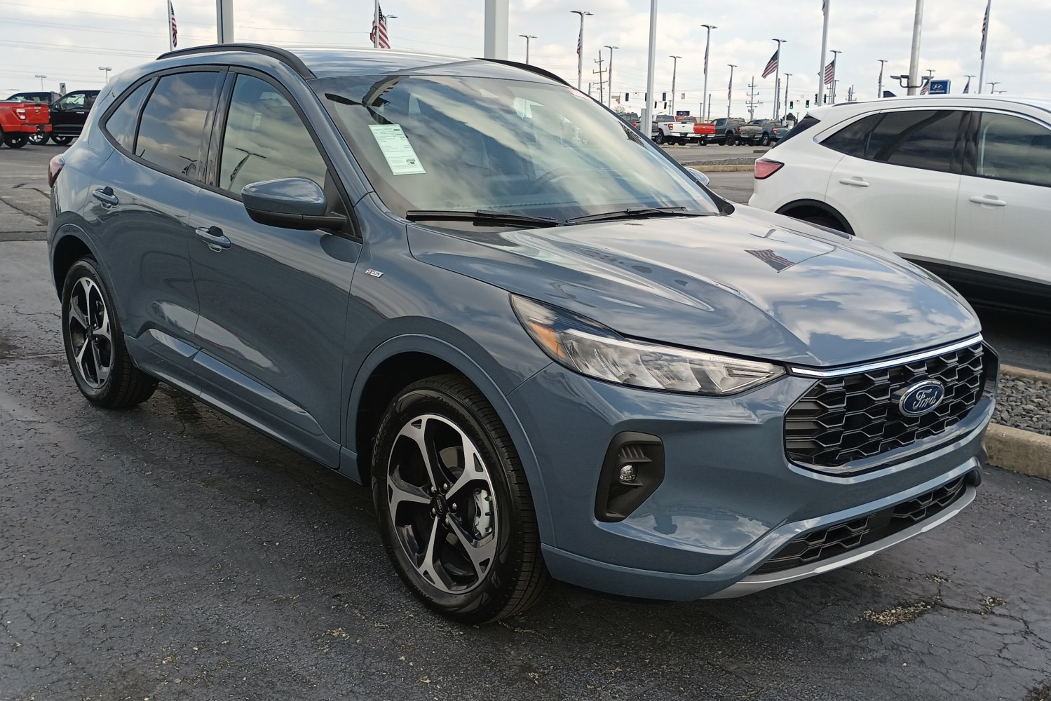 Front-side view of a modern SUV with distinctive alloy wheels and headlamps