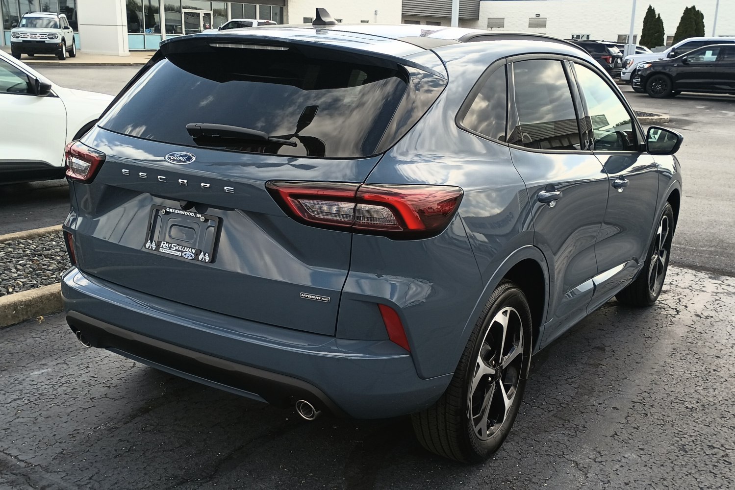 Rear view of SUV with hybrid AWD badge and modern taillights