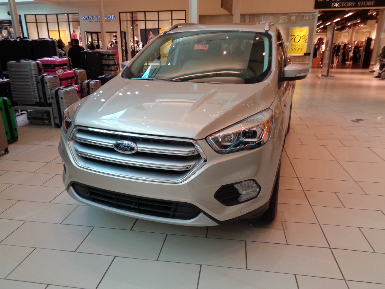 Front view of modern SUV with headlight and grille details