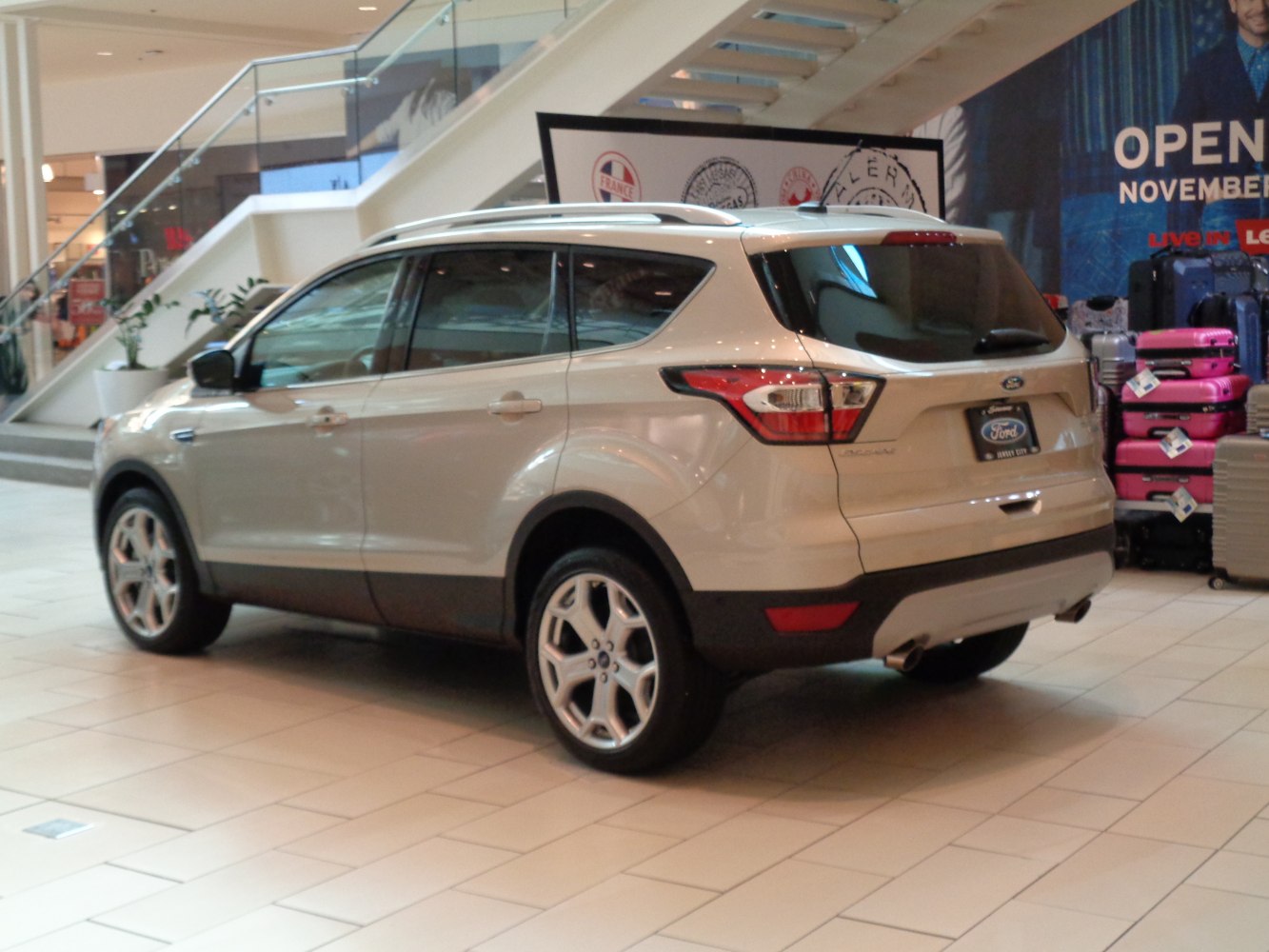 Rear and side profile of a modern SUV with alloy wheels.