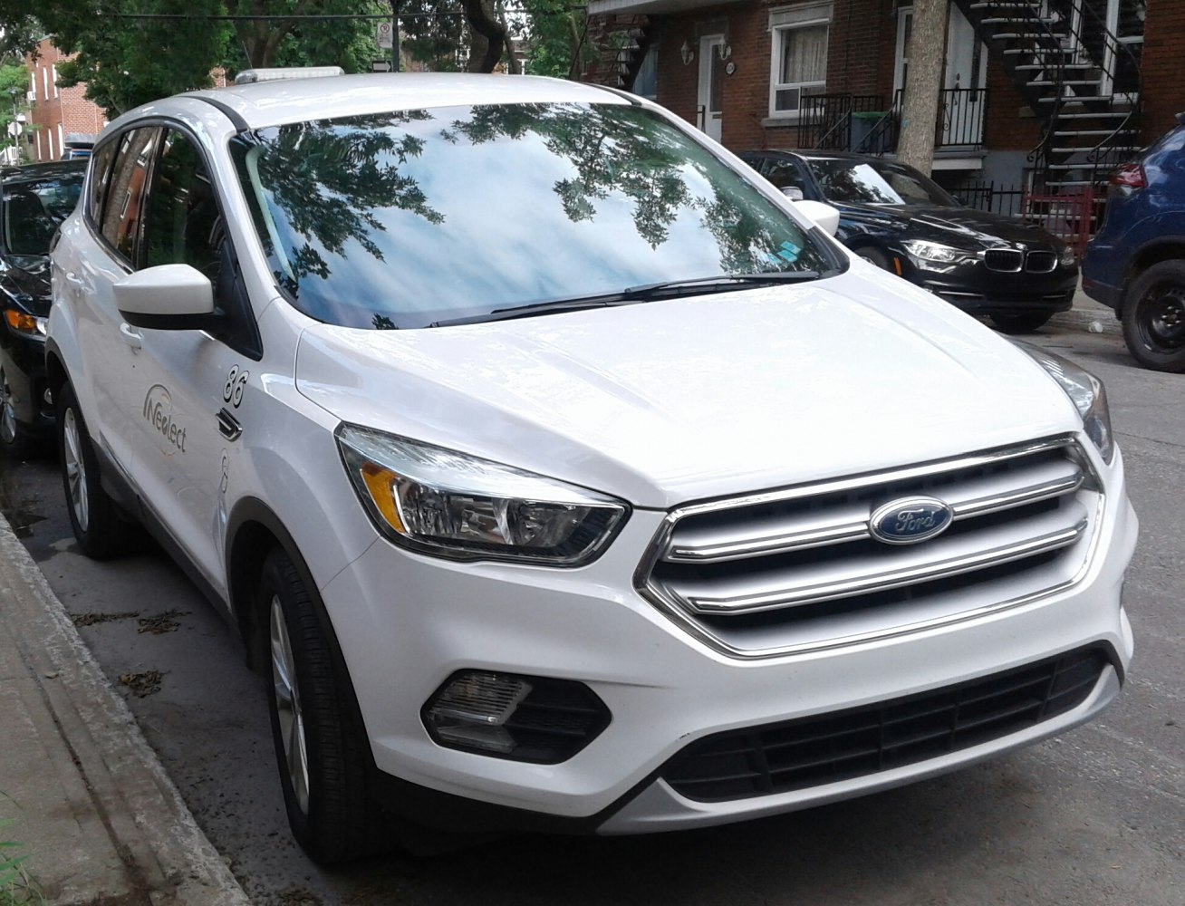 Front grille and headlight design of a modern SUV front.