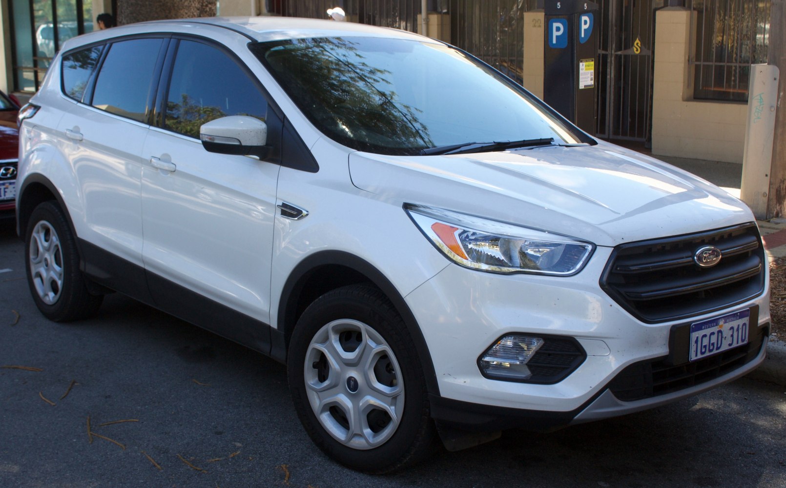 Front side exterior view with headlights, grille, and body profile
