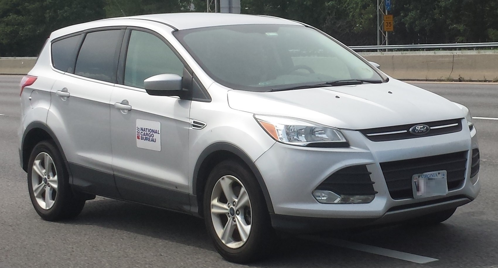 Silver compact SUV side profile with alloy wheels and front grille