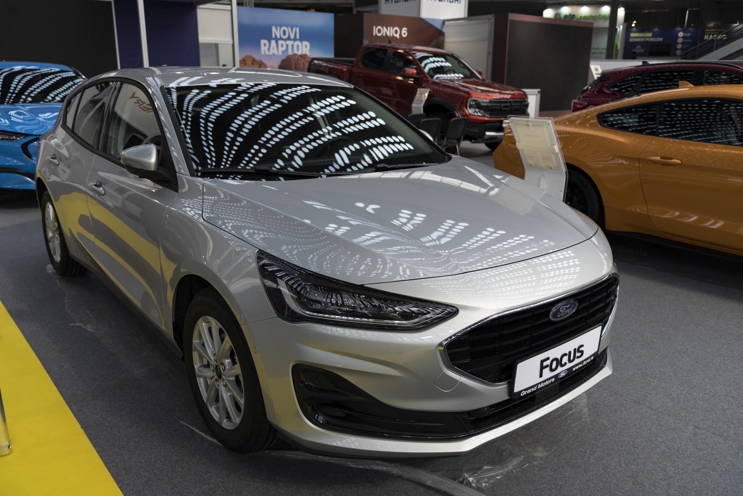 Silver hatchback with sleek front grille and modern LED headlights
