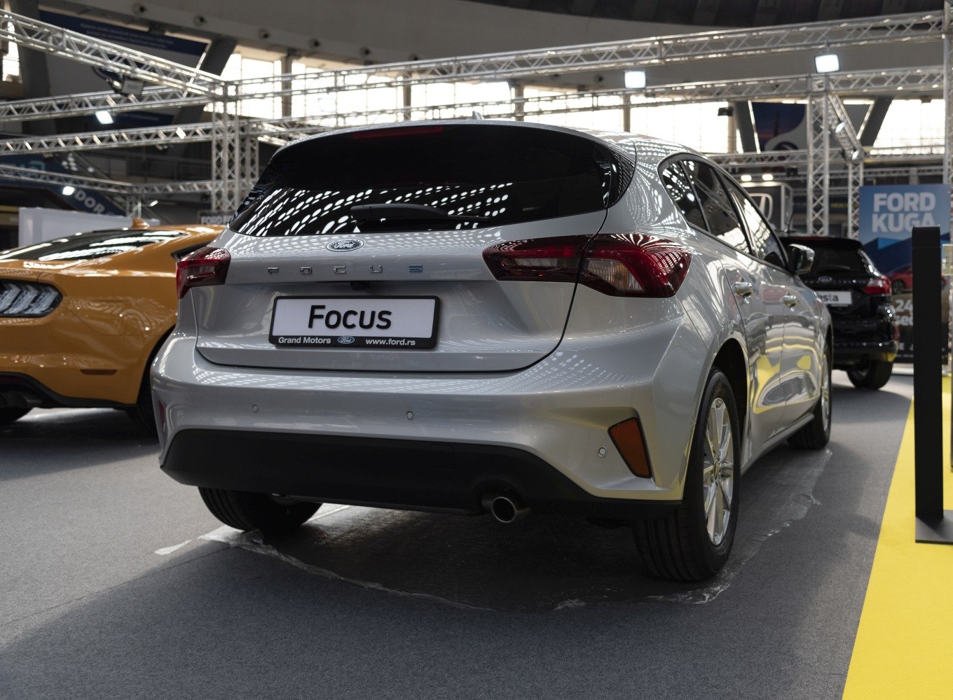 Rear view of modern hatchback with updated taillights and bumper design