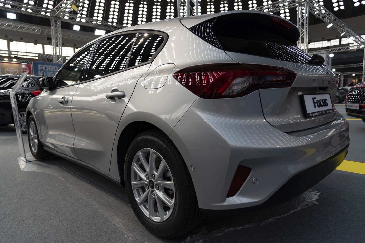 Rear and side view of hatchback with alloy wheels and modern taillights