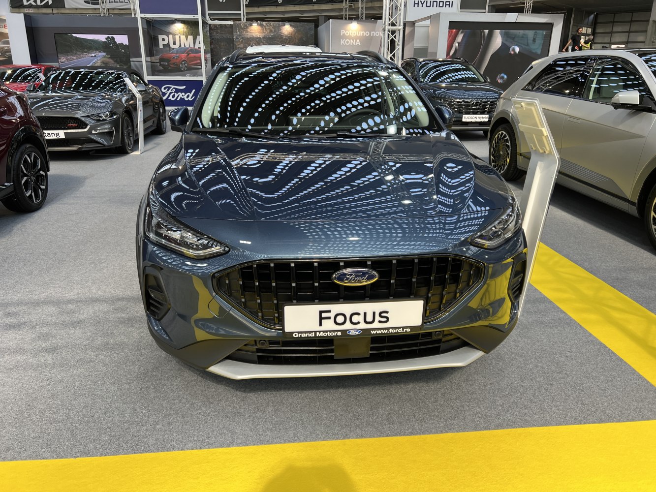 Front grille and headlights of a modern hatchback with a glossy finish