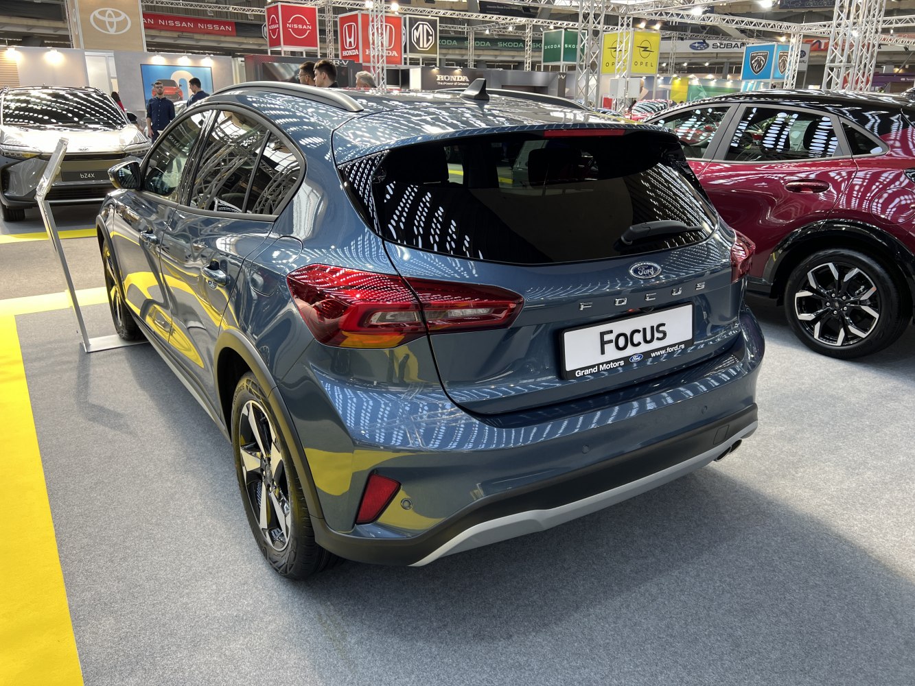 Sleek rear hatchback with modern taillights and sporty bumper.