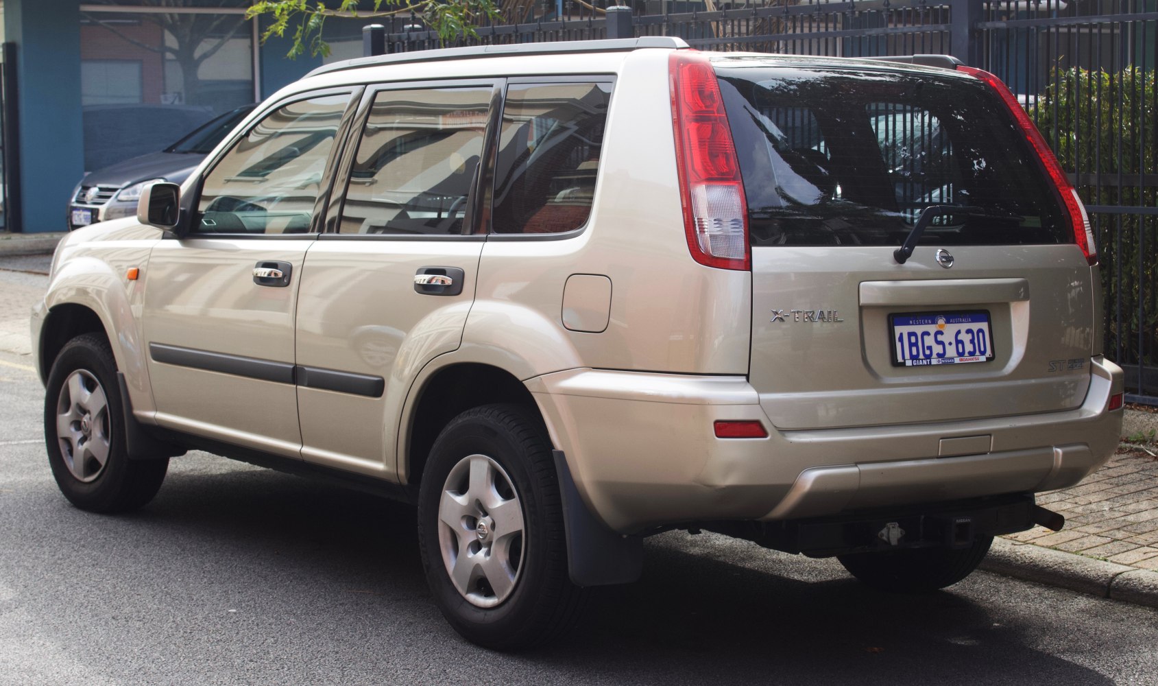 Rear and side profile of a mid-size SUV with distinctive vertical tail lights.