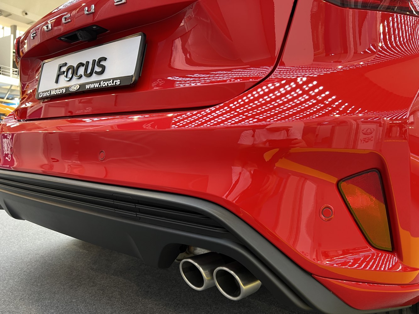 Rear bumper with dual exhaust and parking sensor